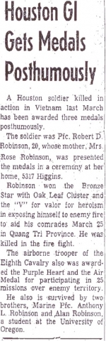 Robert Robinson receives Viet Nam honors. Medals include bronze star with V and oak leaf cluster for valor and heroism.  